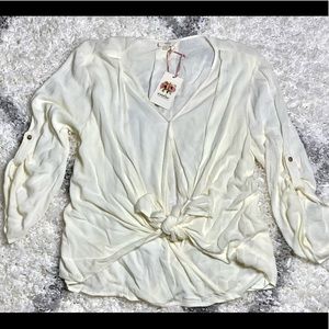 Cream color tie front shirt. Never worn, new with tags. Size L.